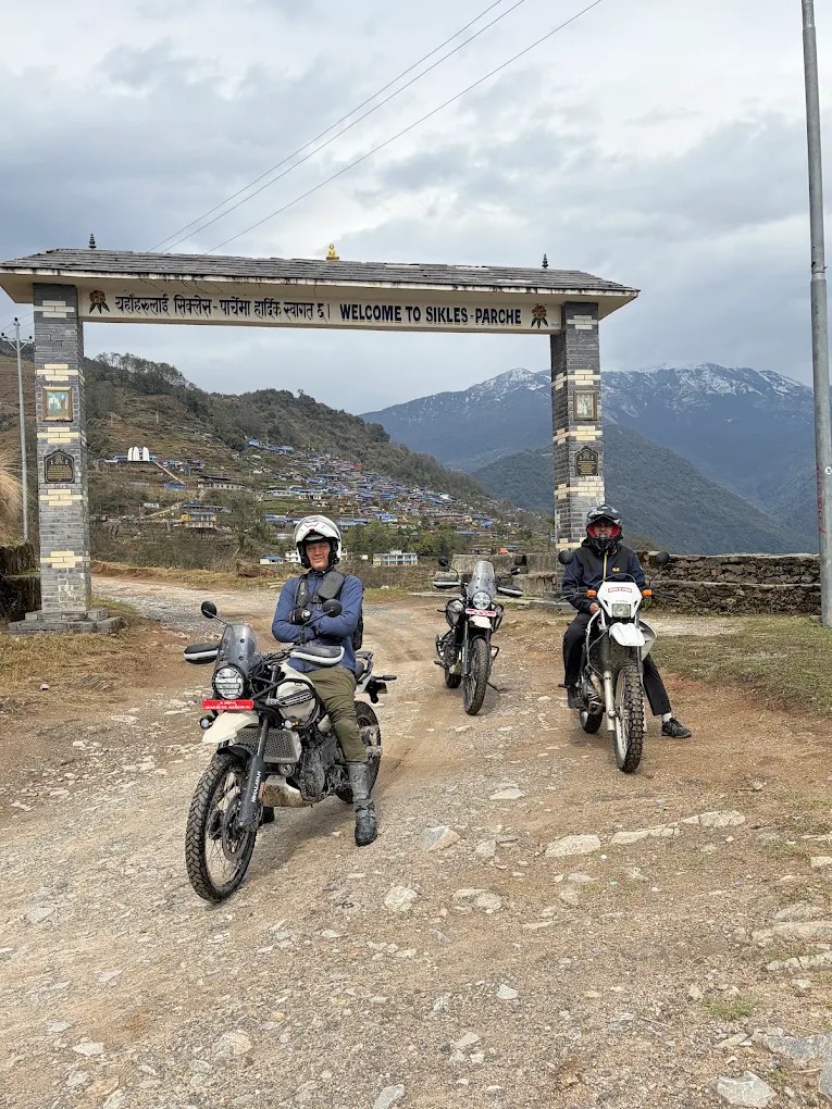 Motorcyclists riding a rocky mountain trail